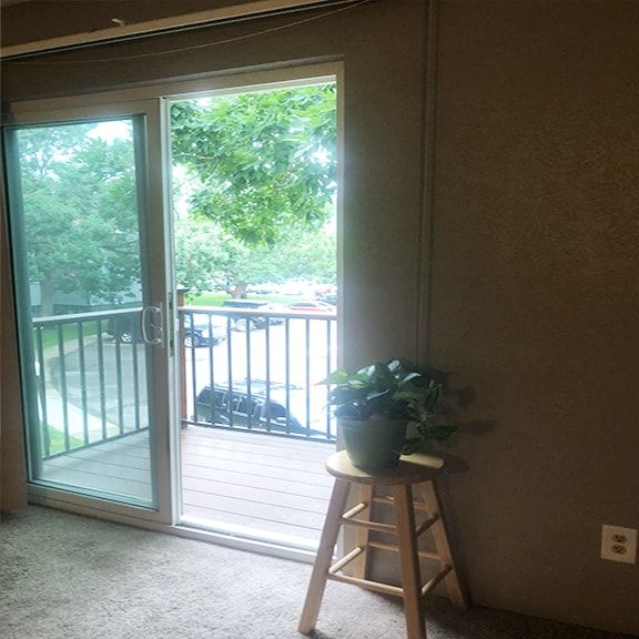 Bright and Cheery, Living room and Dining Room Leading to Your Private Deck and Vew of the Mountains - 16259 W 10th Ave Unit L6