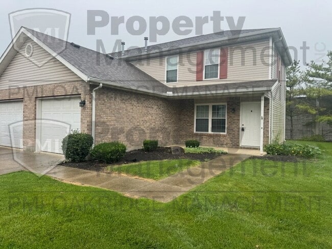 Building Photo - Two Bedroom Townhome with Attached Garage Unit A