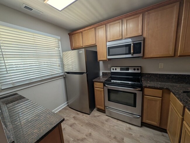 Photo - Cozy condo located in the Williamsburg on Commonwealth community minutes from Plaza Midwood! Unit F