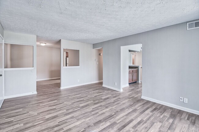 Spacious living room with hardwood-style flooring