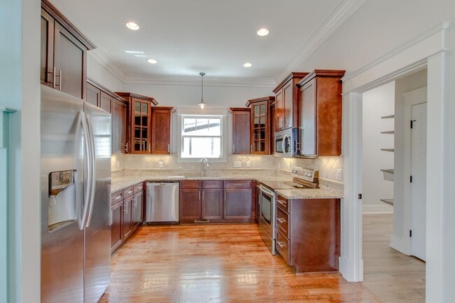 Photo - Stunning 4 Bedroom / Amazing Location / Fenced in Backyard / Beautiful Covered Front Porch