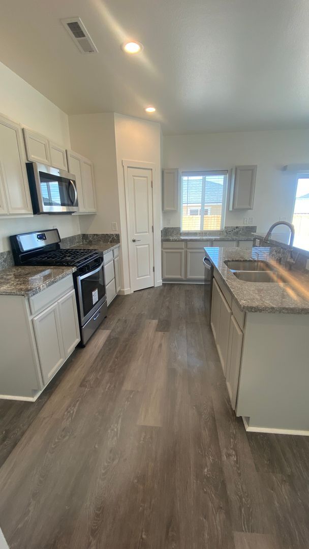 Photo - Brand new home with LVP flooring t/o, gran...