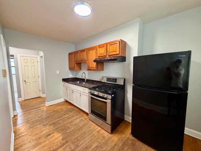 Building Photo - 6501 S Maplewood Ave Unit 2523-1