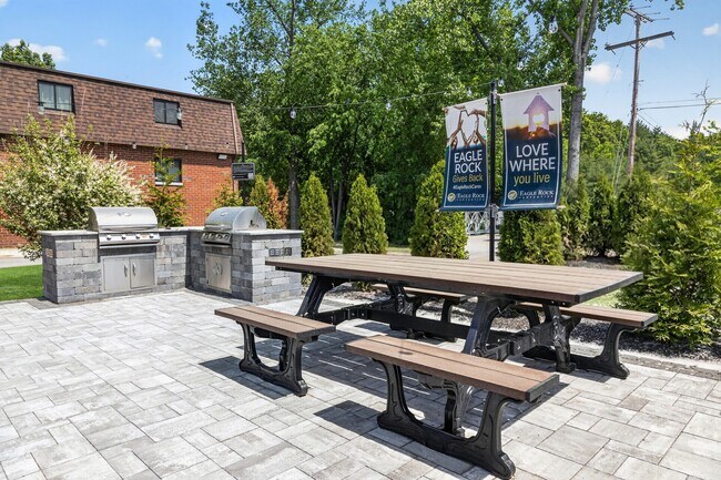 Elevate your lifestyle at Eagle Rock Apartments at Hudson with our inviting outdoor grilling area, perfect for gatherings. Enjoy spacious seating and beautiful landscaping that sets the stage for relaxation. Join us and schedule a visit today!