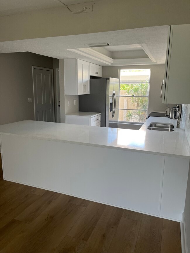 Kitchen With Large Quartz Countertop - 16251 Dublin Cir Unit Sanibel Way