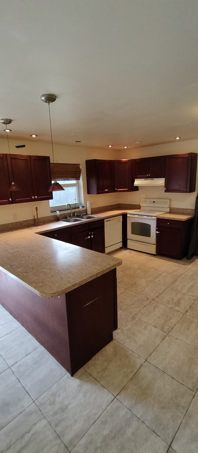This is the kitchen - lots of countertop space - 12126 Gibbs Rd Unit 12126