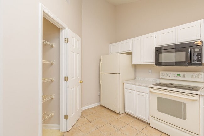 Photo - Beautiful 4 bed 2 bath home in Greensboro with fenced yard. Walk to coffee shop and restaurants.