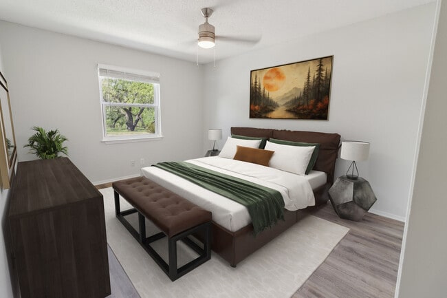 Spacious bedroom with wood flooring - River Point