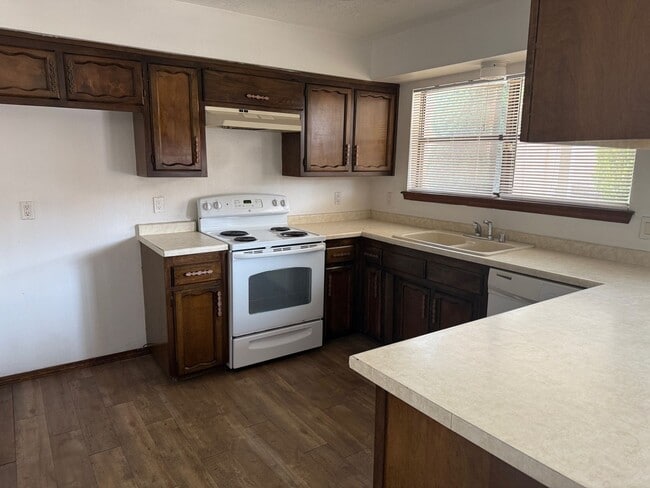 Photo - 4 Br, 1.75 Ba, 2 living areas, formal dining room, 2 CG, nice yards, storage shed
