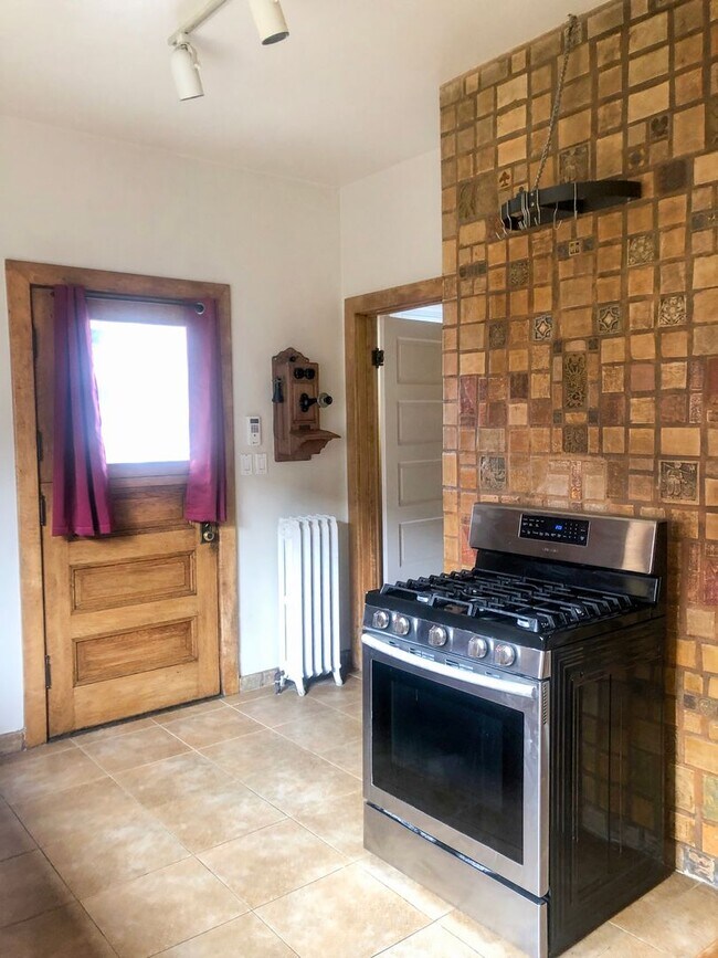 Photo - Historic North Slope Charm with Sweeping Sound Views — 4BR/1.5BA Unidad A