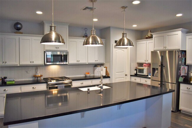 Photo - Solar powered open concept home located in the newer Brighton Landing subdivision!