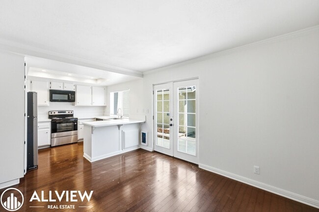 Photo - Fully Renovated 2 Bed Townhome with Private Patio, 2-Car Garage & Community Pool