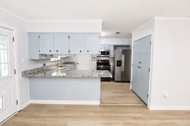 Photo - Spacious 4BR, 2BA Central Pensacola Home on a Large Corner Lot with Sunroom & 2-Car Garage