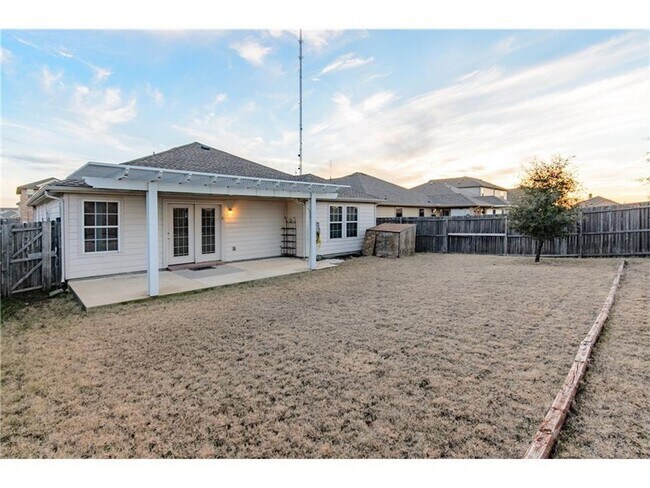 Photo - Beautiful single-story home with a front garage featuring a 3-bedroom, 2-bath split floor plan.