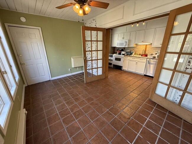 Dining Room/Sunroom and Kitchen - 218 E Orange St Unit Apt. 2