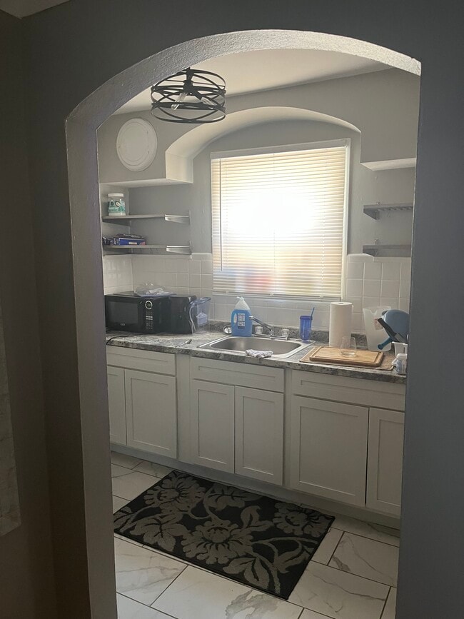 Kitchen. Stainless steel appliances. Microwave and air fryer. - 6139 Alaska Ave Unit 6139