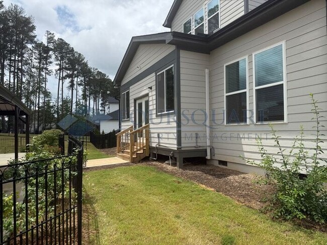 Photo - Elegant 4-Bed / 3.5-Bath Home with Main-Level Primary Suite, Quartz Kitchen & 3-Car Garage – In H...