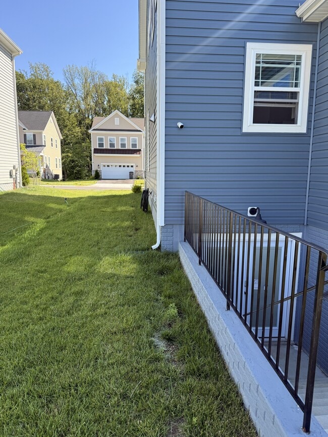 Walkway to the entrance is scheduled to be paved. - 2907 Bridgewater Dr Unit Basement Apartment