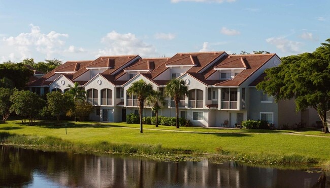 Homes at Polo Lakes look across green space toward the community lake.