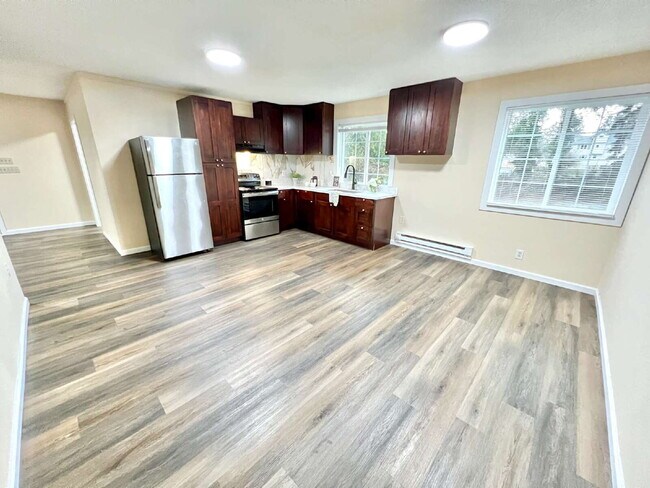 Photo - Elevated 3-Bedroom Home with Secure Garage & Cozy Living Space Unit C