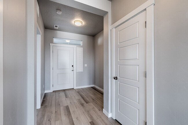 Photo - Custom Hunter-Douglas shutters throughout.