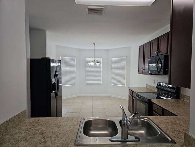 Photo - Nice 3 bed 2 bath 2 car garage single family home in Cape Coral with lawn care included.