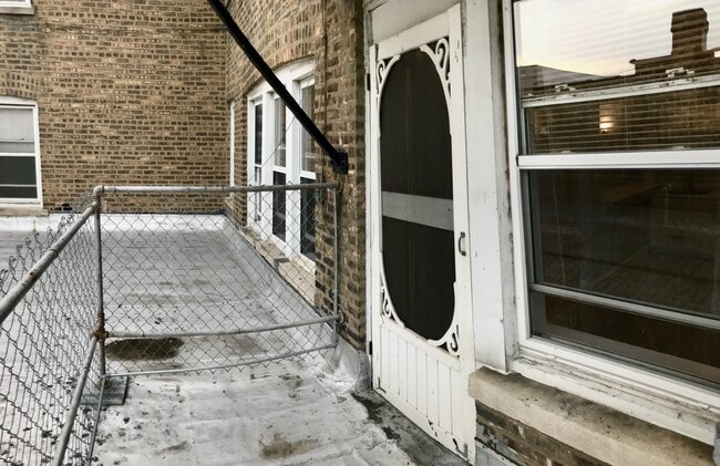 Building Photo - 4165 S Archer Ave Unit 203