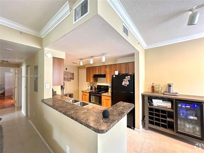 Building Photo - 5820 W Sample Rd Unit 105 Rental