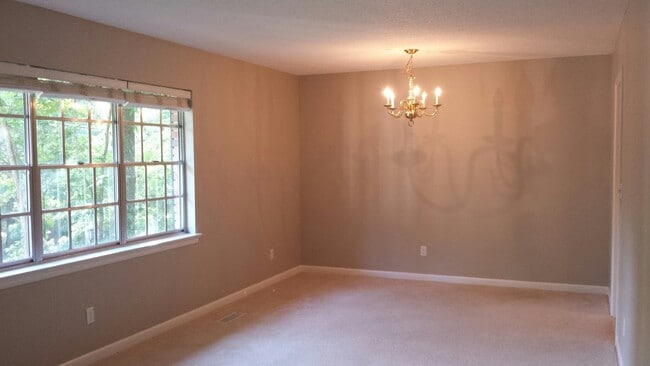 All windows are updated throughout the house. Upper living area can be a shared living/dining area or a large living room. Chandelier has been replaced with a flush mount light fixture since photo was taken. - 826 Murrell Rd Unit A