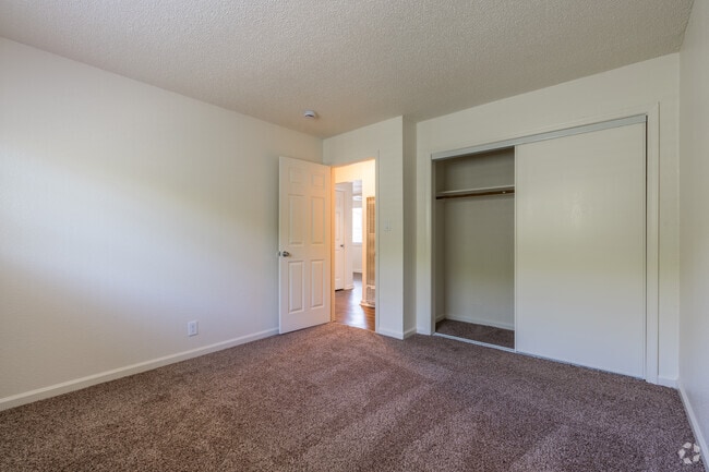 2BR, 1BA - 675SF (Hardwood) - Primary Bedroom - Stonebrook Apartments