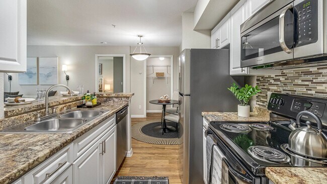 Experience top-of-the-line stainless-steel appliances in a remodeled kitchen with breakfast bar. - Meadow Lakes