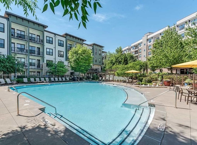 Resort style swimming pool with lounge seating