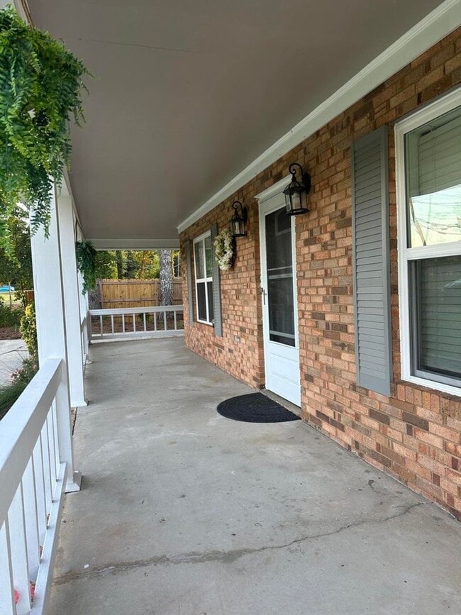 Photo - Move-In Ready Corner-Lot Home with Wraparound Porch Near Fort Eisenhower