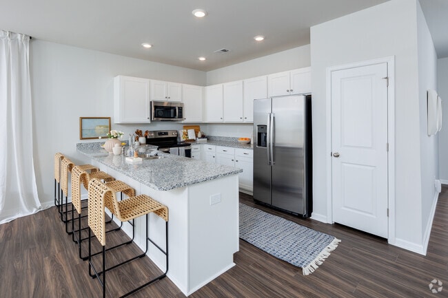Kitchen from living room. - Mill Branch At Spring Hill