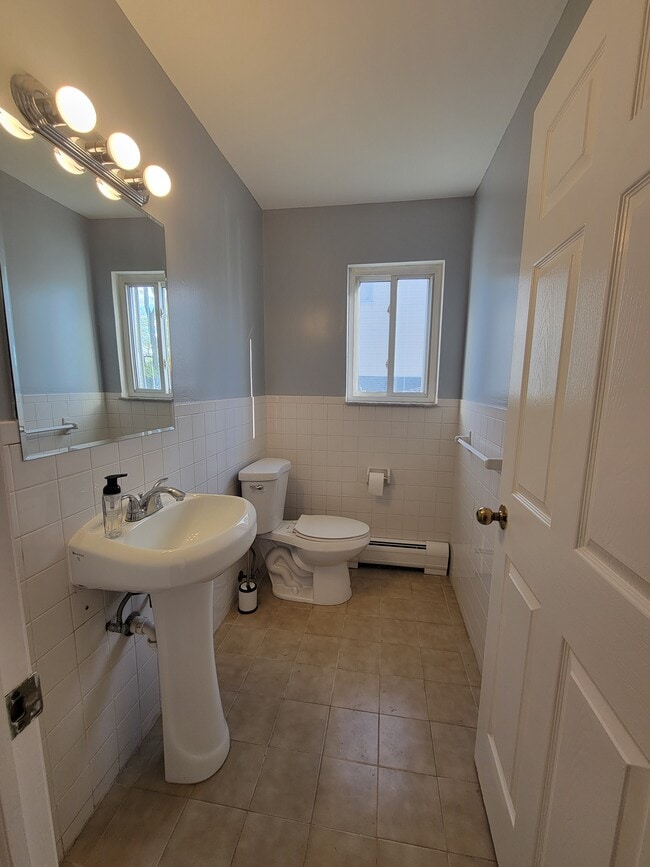 Half bathroom conveniently located off kitchen, across from main floor laundry - 103 Prescott Ave