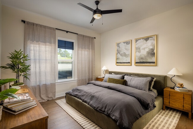 Bedroom with oversized windows, high ceilings and natural light