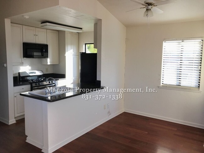 Photo - Charming Two-Story 2-Bed 2-Bath Home with Wrap-Around Balcony & Hardwood Floors in Seaside