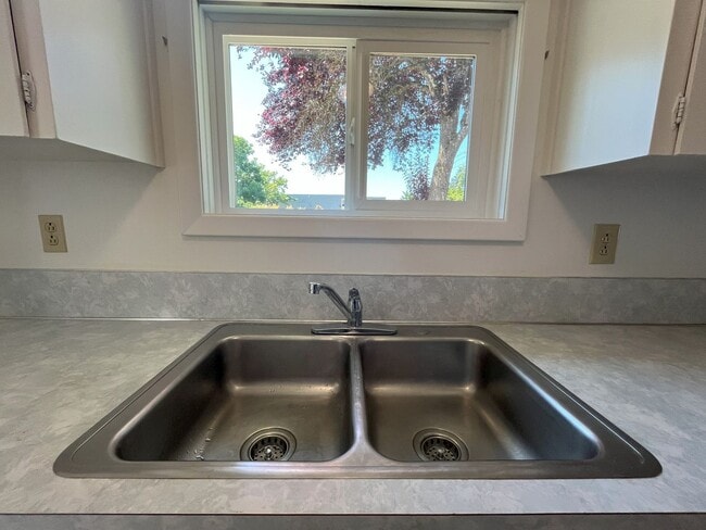 Photo - Charming 2-Bedroom Home with Open Living Space and Tile Flooring