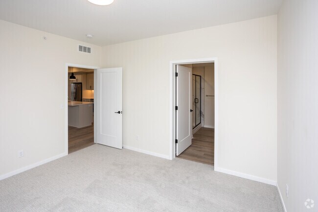 2BR, 2BA - 1,193SF - Primary Bedroom - The Uptown Apartments