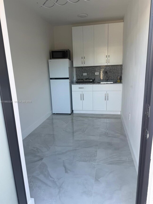 Building Photo - 67XX SW 134th St Unit C