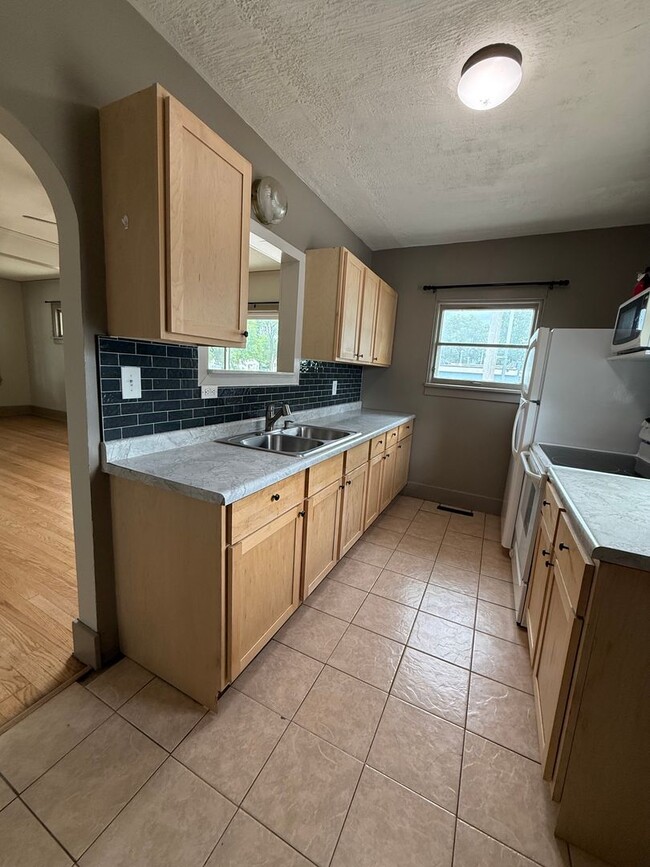 Photo - Charming 2-Bedroom Home with Spacious Backyard and 2-Car Garage