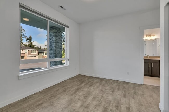 Photo - Stunning 5 Bedroom Home with Guest Suite, Modern Kitchen & Fenced Yard