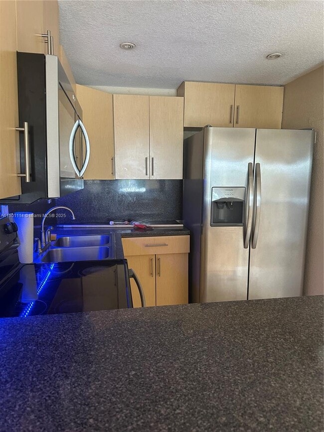 Building Photo - 6095 W 19th Ave Unit 407 Rental