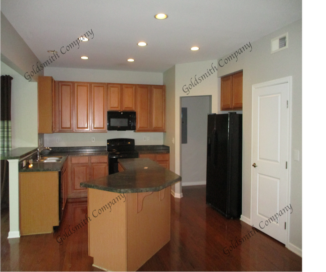 "4-Bed in Greenville - Spacious 2,389 Sq Ft with Fireplace & Hardwood Floors!"