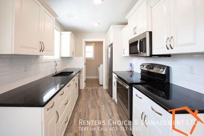 Photo - 2 Bedroom Basement Suite, Insuite Laundry, Assigned Parking
