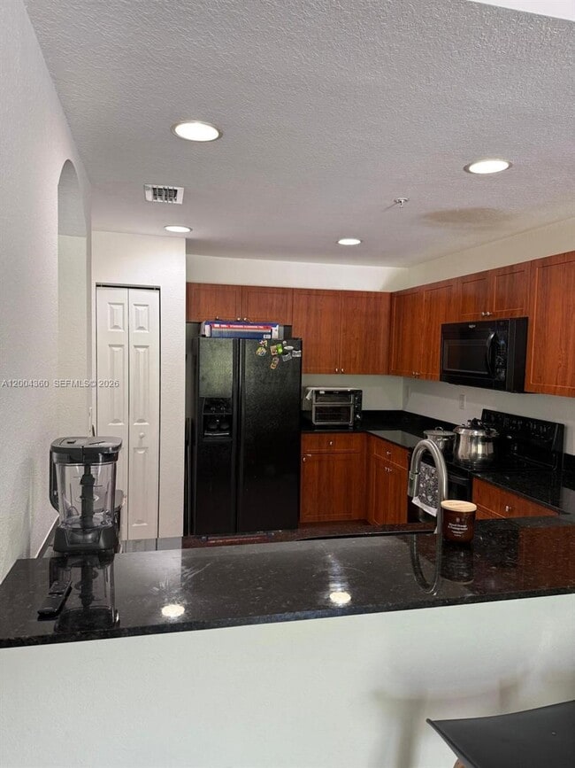 Building Photo - 8999 NW 107 Ct Unit 210-1