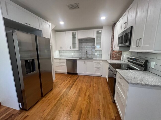 Brand New Kitchen with Quartz Countertops, Stainless Steel Samsung Appliances & Soft Close Cabinets - 3880 Walsh St Rental