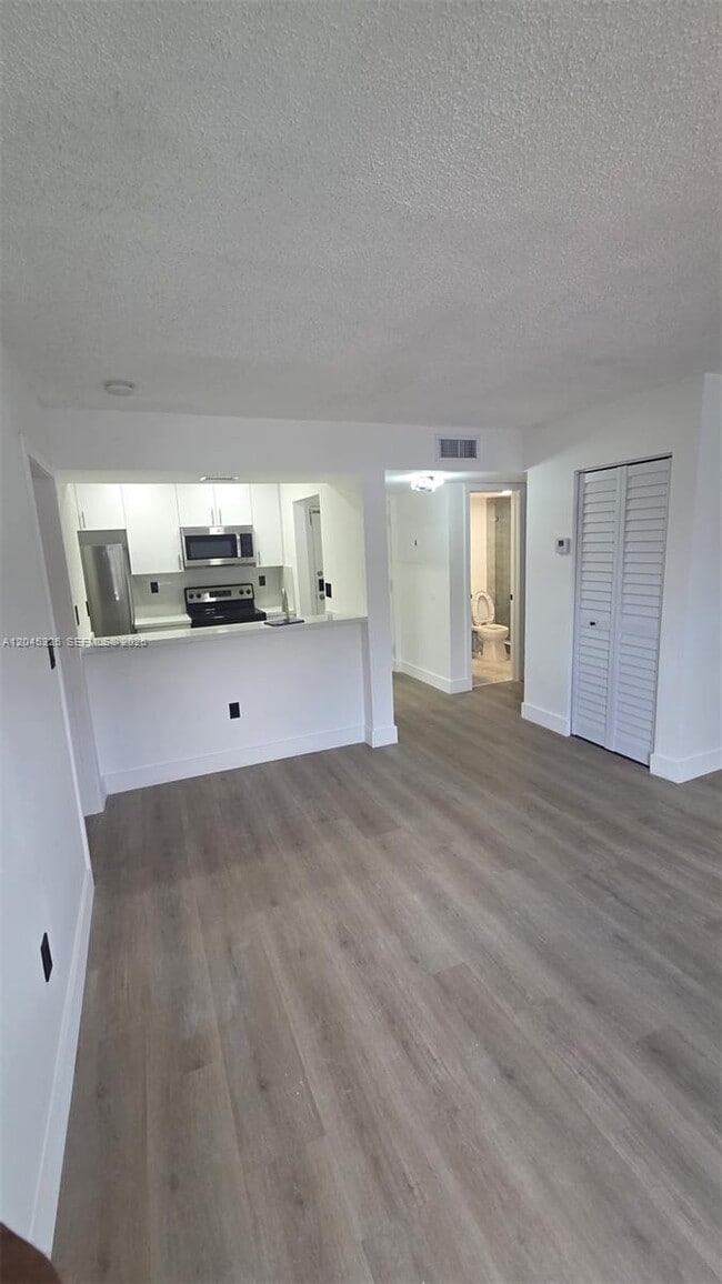 Building Photo - 7125 NW 186th St Unit B201