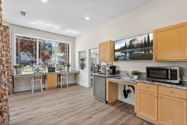Clubhouse perks include a cozy coffee bar and business center.