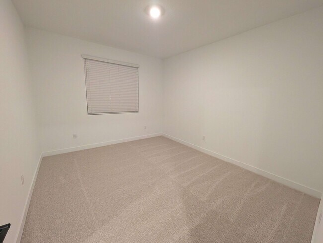 Large 13' x 11' bedroom with carpeted floor - 628 S Cecita Wy Unit ADU